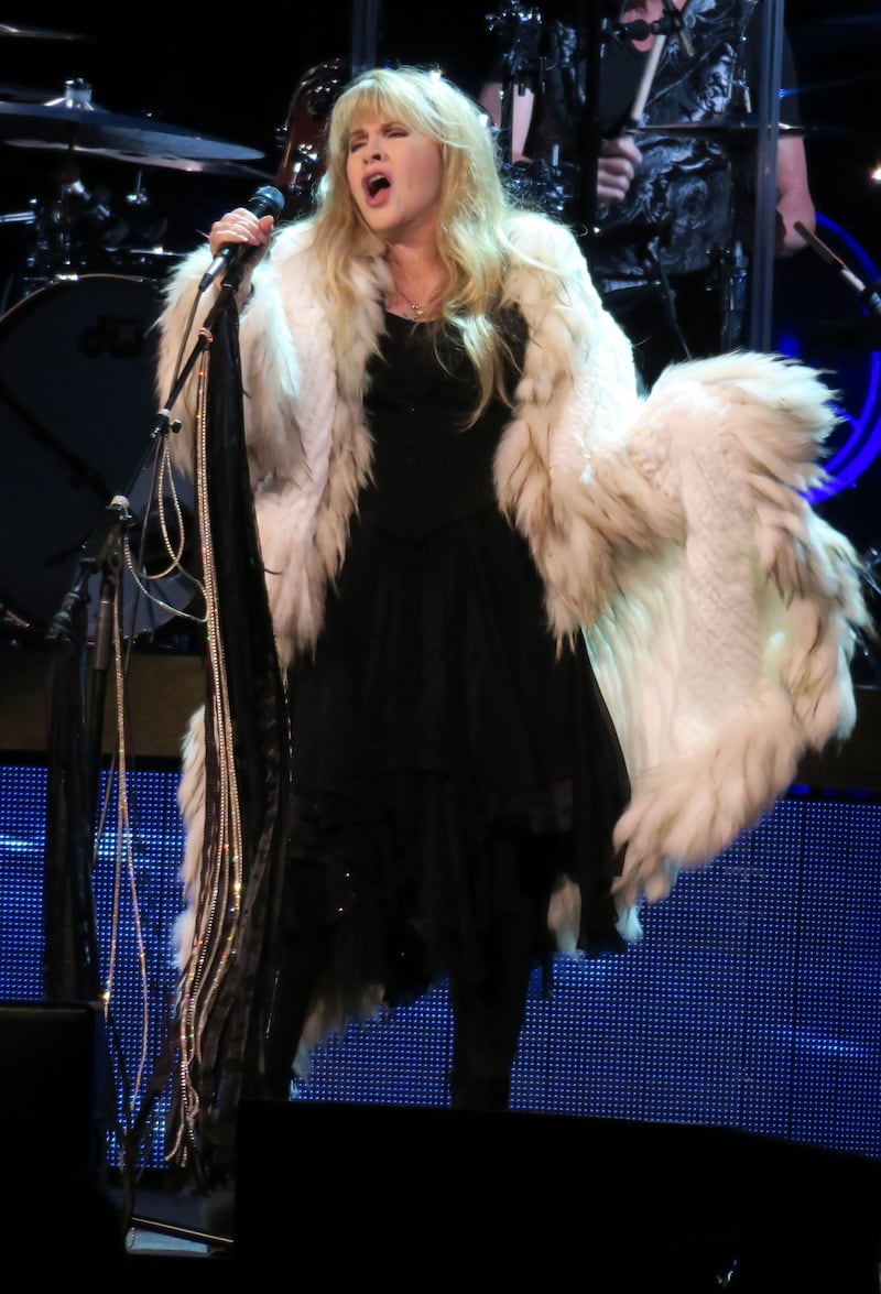 Stevie Nicks combines clashing textures and fabrics in the form of lace, velvet and fur