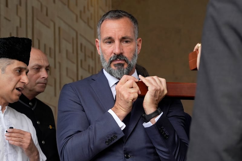 Prince Rahim Al-Hussaini, who was named on Wednesday as the new Aga Khan, helped carry the coffin (Ana Brigida/AP)