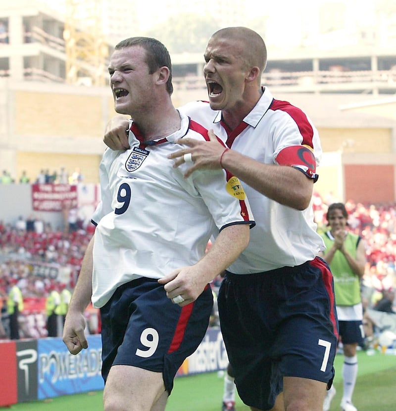 Wayne Rooney, left, celebrates with David Beckham after scoring against Switzerland at Euro 2004