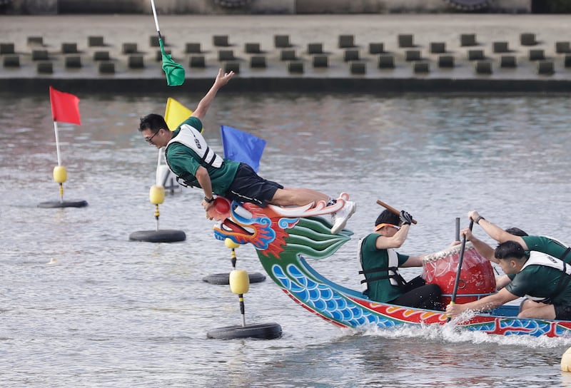 A close finish in one dragon boat race in Taipei, Taiwan (AP)