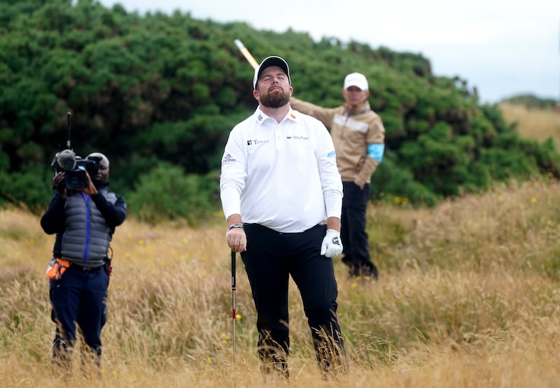 Ireland’s Shane Lowry reacts as he plays a shot from the rough on the 11th during day two at Royal Troon