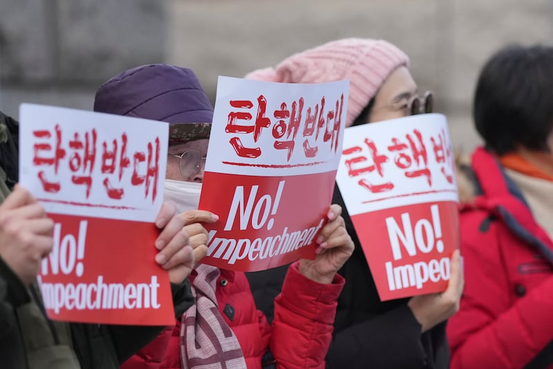 Supporters of impeached South Korean President Yoon Suk Yeol stage a rally outside the Constitutional Court in Seoul (Lee Jin-man/AP)