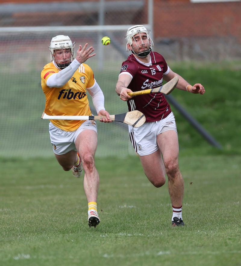 Antrimâs Paddy Burke and Galwayâs Jason Flynn  in action during Sundayâs Allianz Hurling League Roinn 1Â game at Corrigan Park in Belfast.PICTURE: COLM LENAGHAN