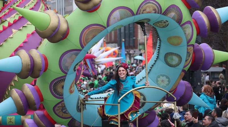 Performers entertain the crowd as  Thousands line the streets for the St Patrick’s day Parade in Belfast on Sunday.
PICTURE COLM LENAGHAN