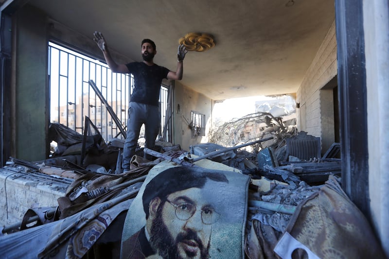 A man stands in a damaged apartment after an Israeli air strike in Saksakieh, south Lebanon (Mohammed Zaatari/AP)