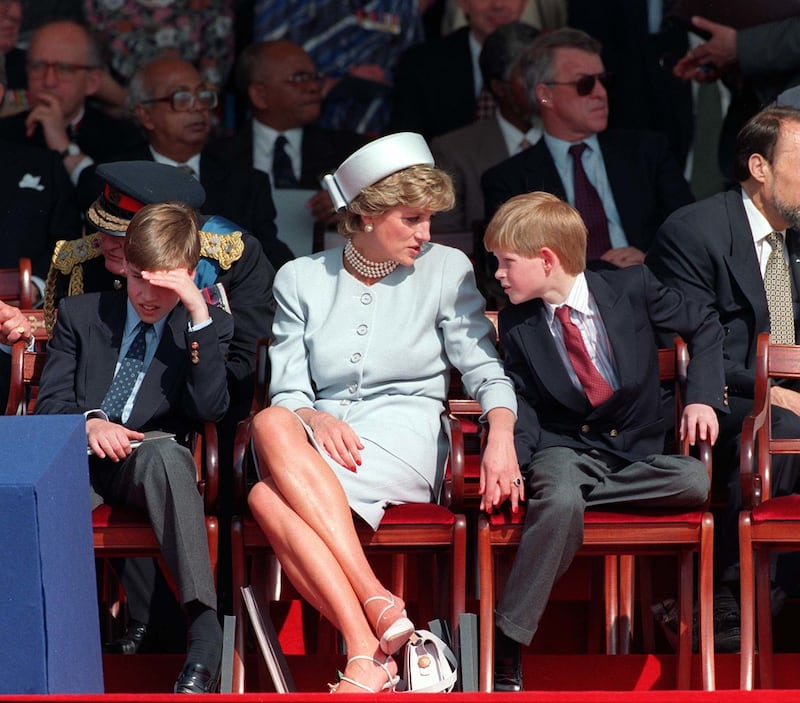 Diana, Princess of Wales talks to a young Prince Harry during the 50th Anniversary of VE Day in 1995