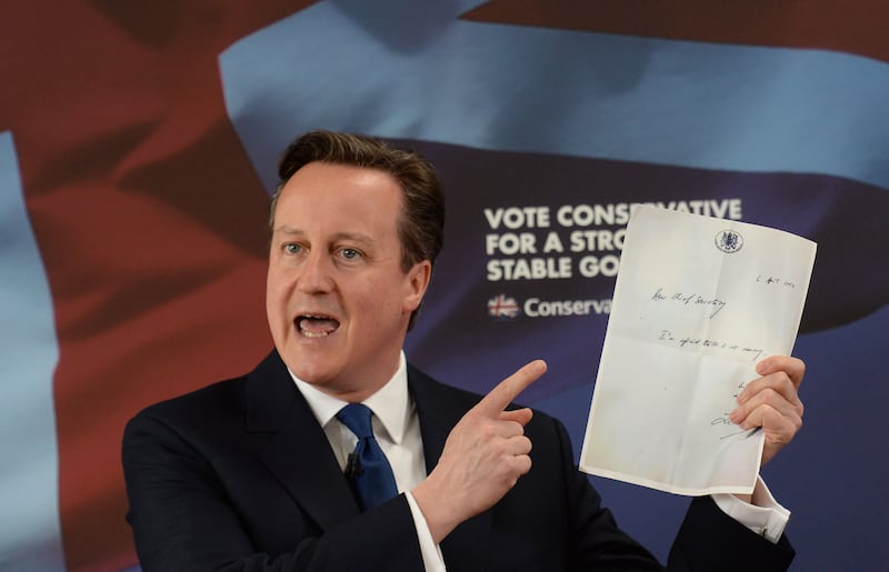 Then-PM David Cameron holds up the note Liam Byrne left on his Treasury desk after Labour’s 2010 election defeat