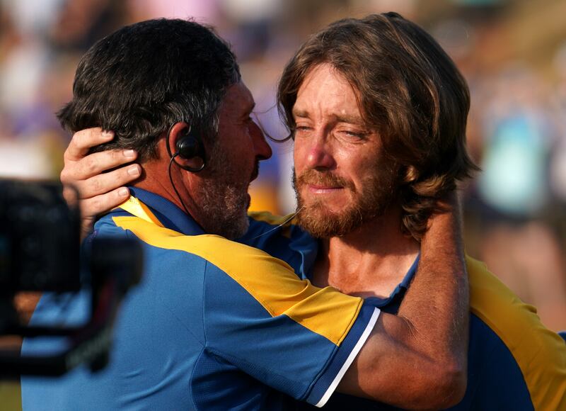 Team Europe's Tommy Fleetwood celebrates with vice-captain Jose Maria Olazabal after Europe regained the Ryder Cup following victory over the USA on day three of the 44th Ryder Cup at the Marco Simone Golf and Country Club, Rome, Italy on Sunday October 1, 2023. Picture by David Davies, PA 