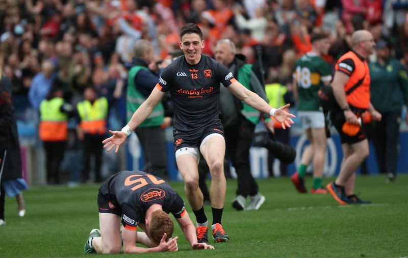 Armagh's Rory Grugan races to embrace team-mate Conor Turbitt.