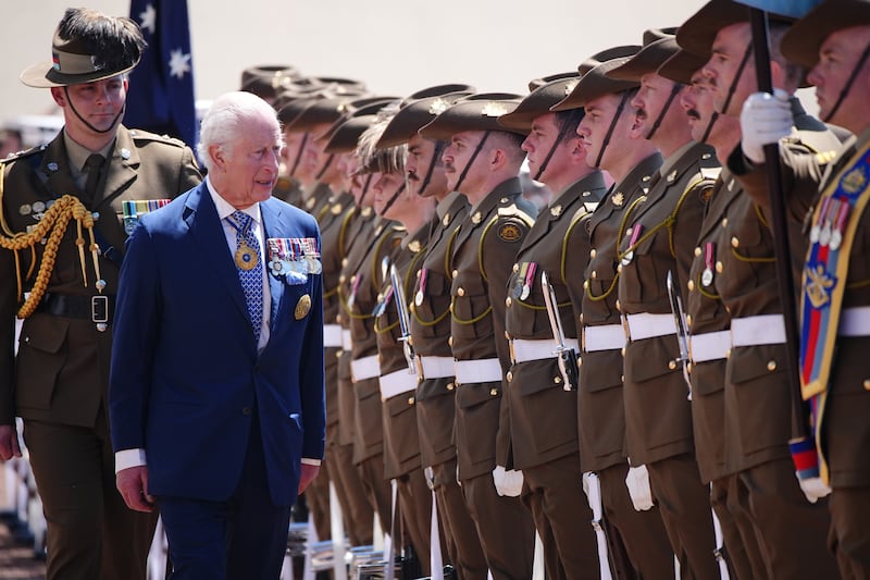 The King views the royal guard of honour during the ceremonial welcome at Australian Parliament House in Canberra