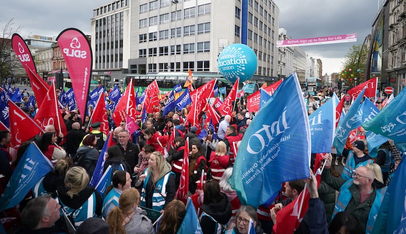 People taking part in a rally outside Belfast City Hall