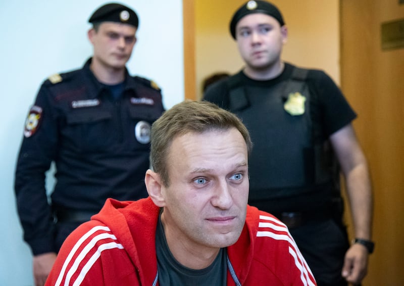 Alexei Navalny speaks to the media prior to a court session in 2019 (AP Photo/Alexander Zemlianichenko, File)