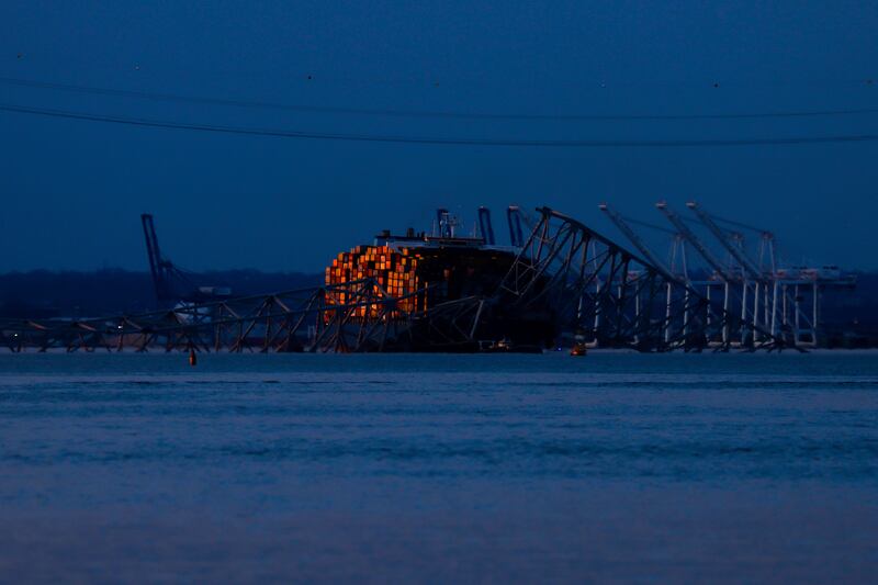 Wreckage of the Francis Scott Key Bridge rests on container ship Dali (Julia Nikhinson/AP)