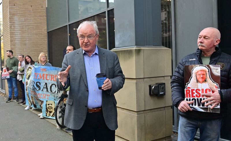 ICRIR chair Sir Declan Morgan speaks with Time for Truth campaigners outside the legacy commission's Belfast HQ. Picture: Mal McCann