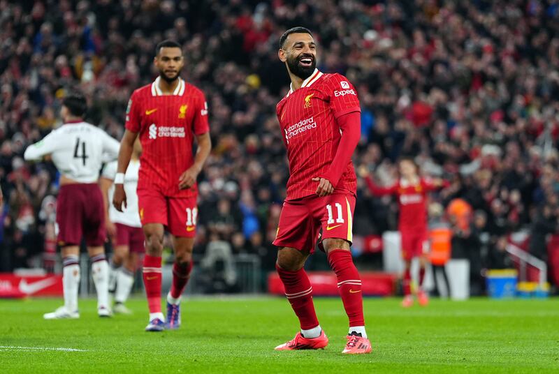 Mohamed Salah celebrates Liverpool’s third goal of the evening