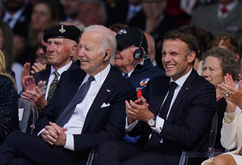 Mr Biden and Mr Macron sat side by side during Normandy commemorations (Jordan Pettitt/Pool)