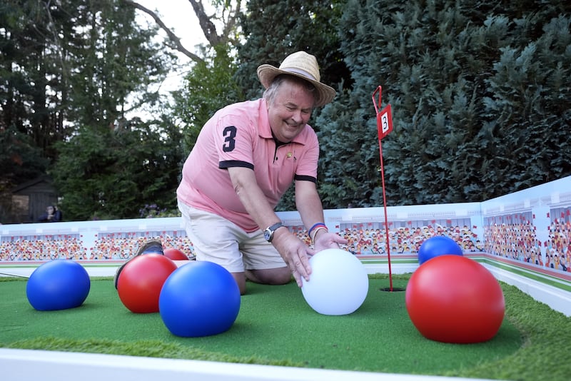 David Lawrence adjusting the layout of one of his holes which is themed around the Paralympic sport of boccia