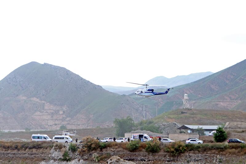 The helicopter carrying Iranian President Ebrahim Raisi takes off at the Iranian border with Azerbaijan (Ali Hamed Haghdoust/IRNA via AP)