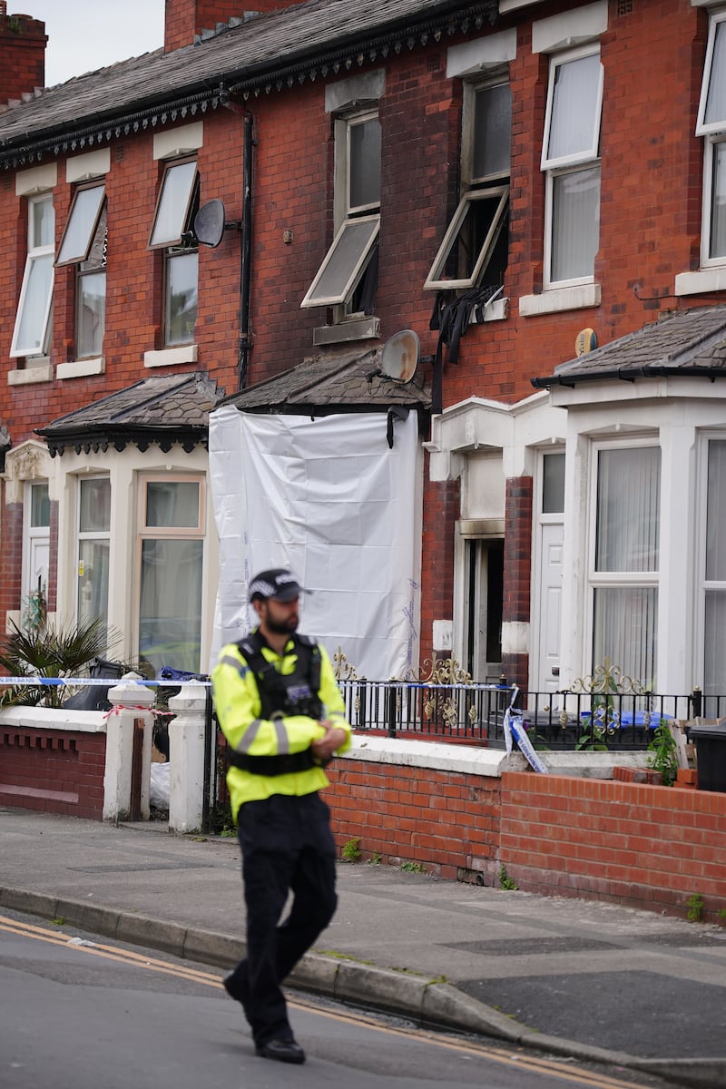 A police officer near a house in Blackpool