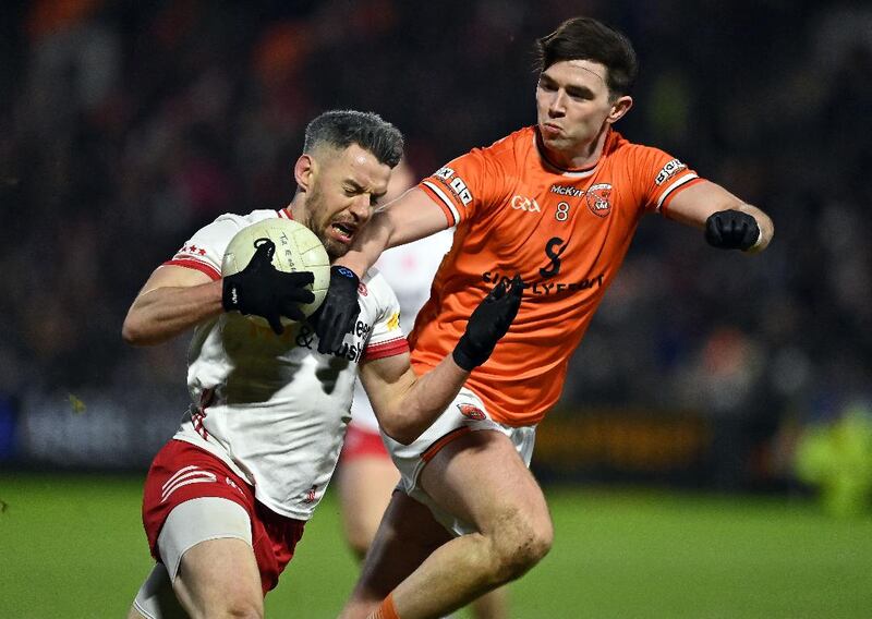 Tyrone's Mattie Donnelly holds off Armagh's Ben Crealey

Picture: Oliver McVeigh