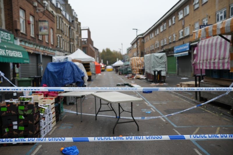 Market tables were seen behind the police cordon