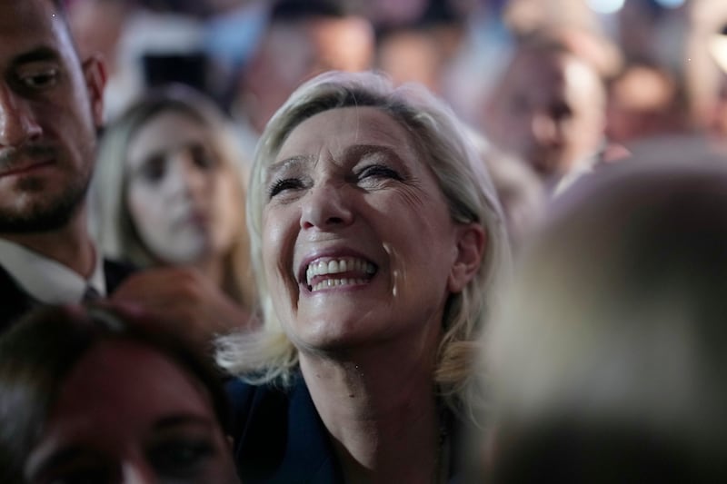 French far right leader Marine Le Pen reacts as she meets supporters after the release of projections based on the actual vote count in select constituencies (Thibault Camus/AP)