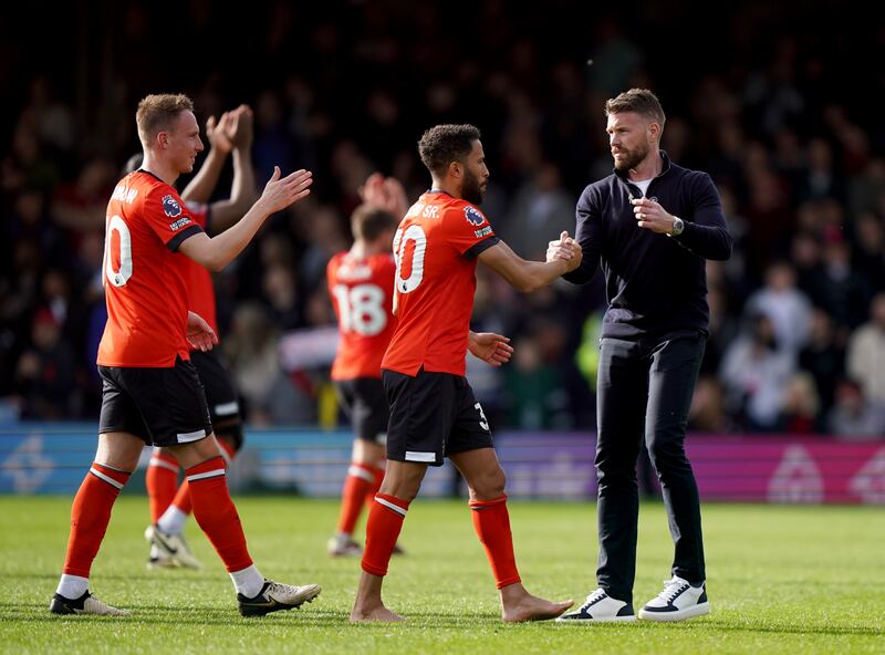 Edwards (right) celebrated with his Luton players at full-time