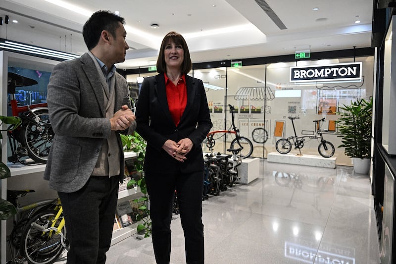 The Chancellor is in China to promote trade links with the world’s second largest economy and boost opportunities for British businesses such as Brompton, whose store she visited (AP)