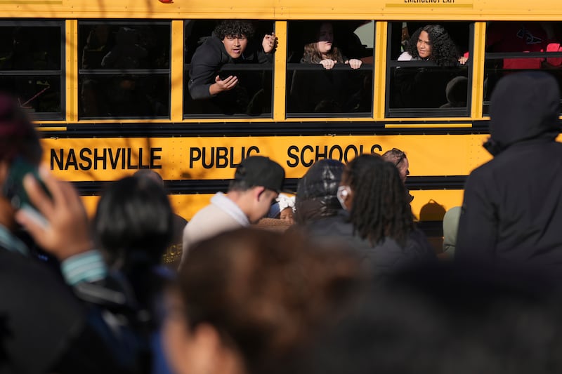 Students wait to get off a bus at a unification site following the shooting (George Walker IV/AP)