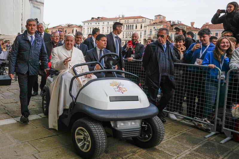 Francis travelled in a popemobile to meet well-wishers outside the Church of the Salute (Alessandra Tarantino/AP)