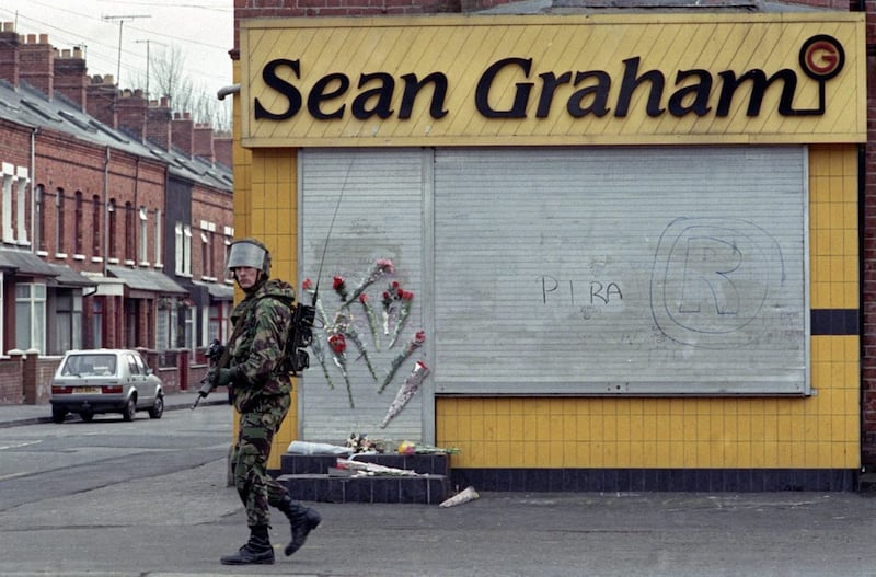 Floral tributes in the aftermath of 1992&#39;s attack on Sean Graham&#39;s bookmakers on Belfast&#39;s Ormeau Road. Picture by Pacemaker 