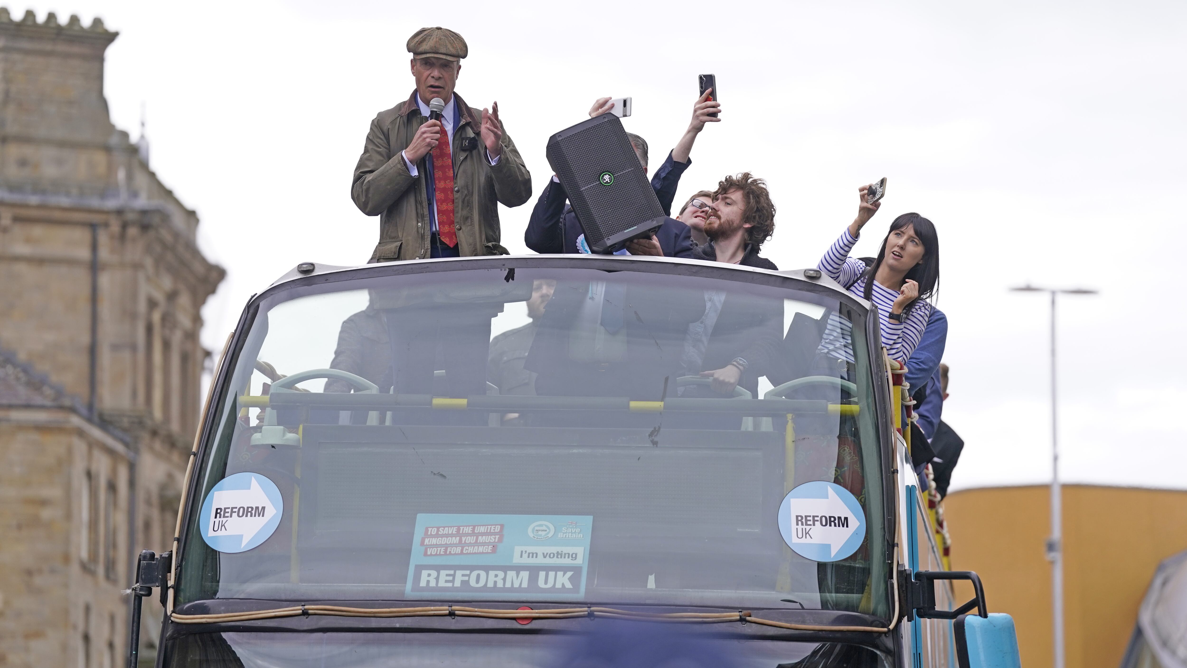 Reform UK leader Nigel Farage makes a speech from the Reform UK campaign bus in Barnsley, South Yorkshire