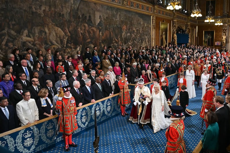 The King, wearing the Imperial State Crown and the Robe of State, and the Queen, wearing the George IV State Diadem, at last November’s State Opening of Parliament