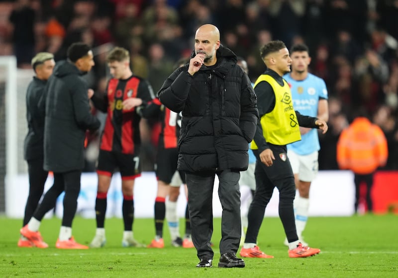 Manchester City manager Pep Guardiola on the pitch after the defeat