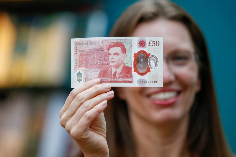 Sarah John, chief cashier of the Bank of England, with an Alan Turing £50 banknote at Daunt Books in London