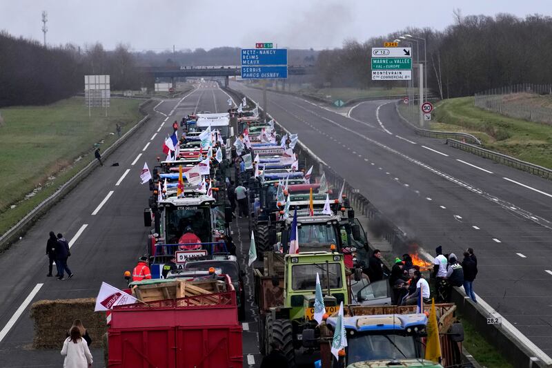 Farmers occupy the highway in Jossigny, east of Paris, with protesting farmers camped out at barricades around Paris