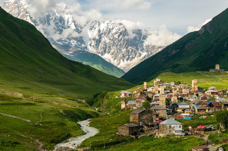 Ushguli village at sunset with Shkhara mountain in the background