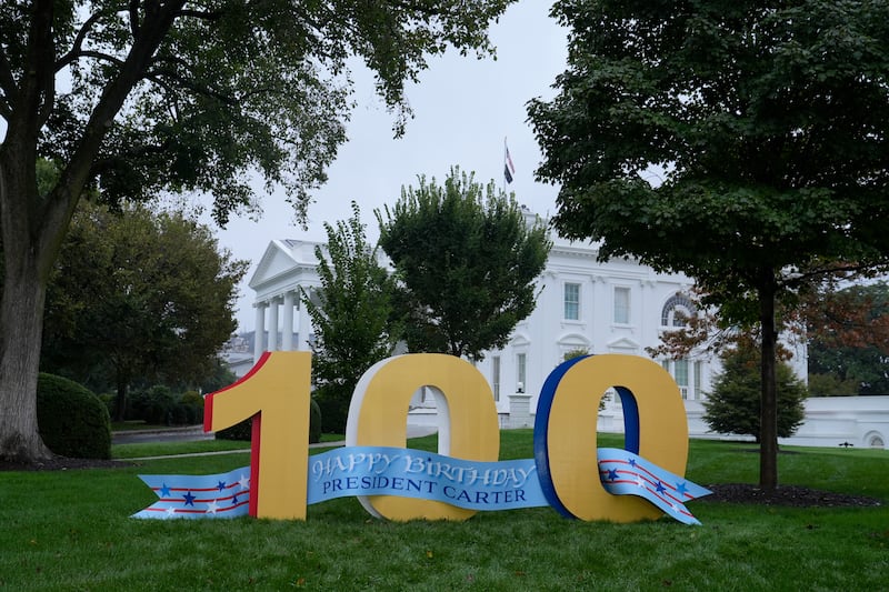 A sign wishing Mr Carter a happy 100th birthday has been erected on the North Lawn of the White House in Washington (Susan Walsh/AP)