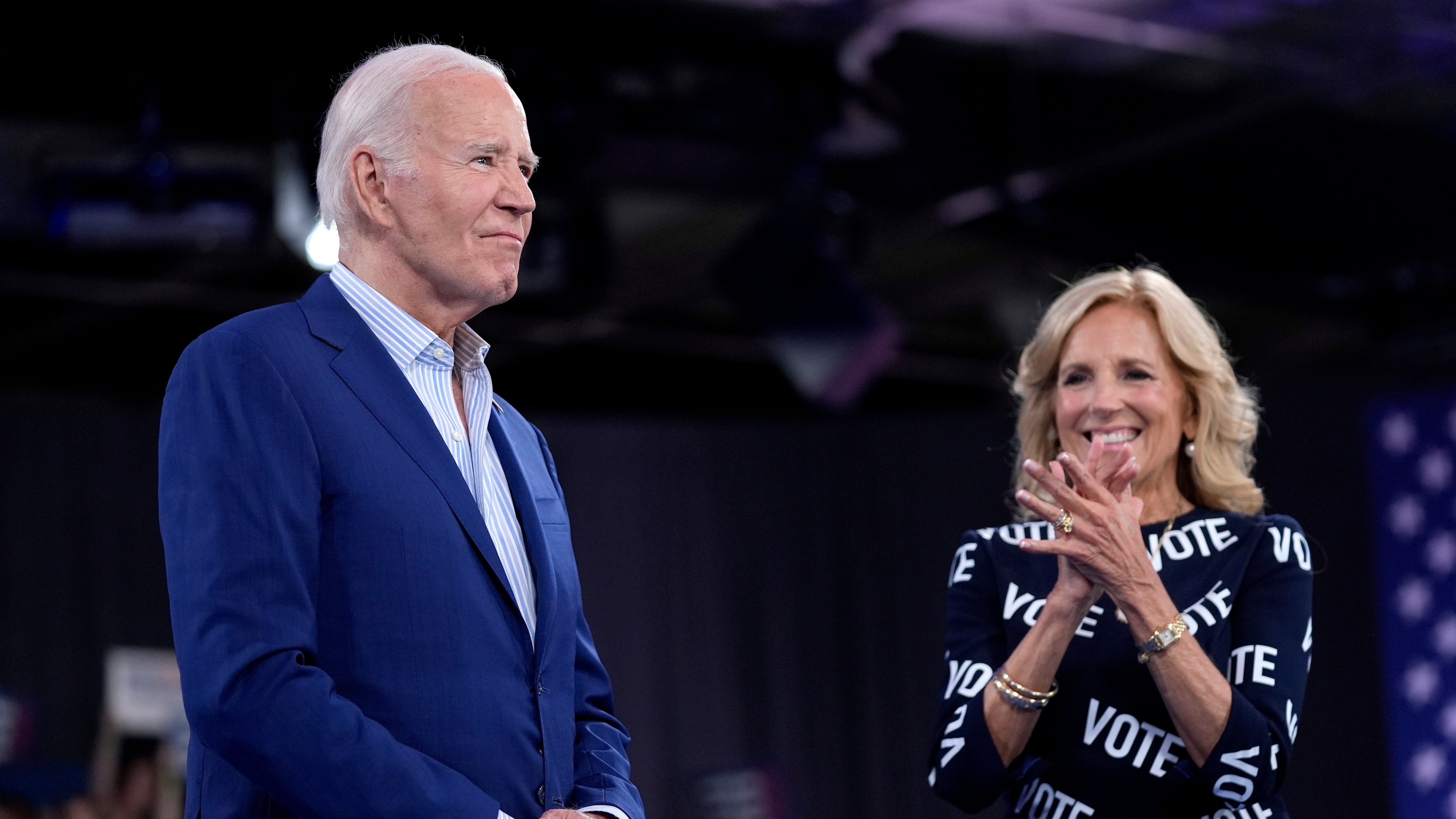 President Joe Biden prepares to speak as first lady Jill Biden looks on (Evan Vucci/AP)