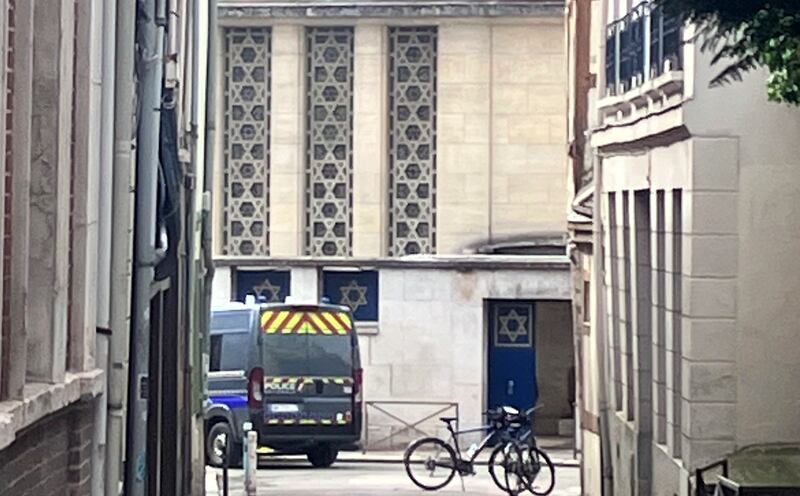 A police car parked in front of the synagogue in Rouen, northern France, on Friday (Oleg Cetinic/AP)