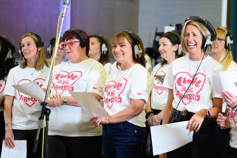 Lorraine singing with the choir