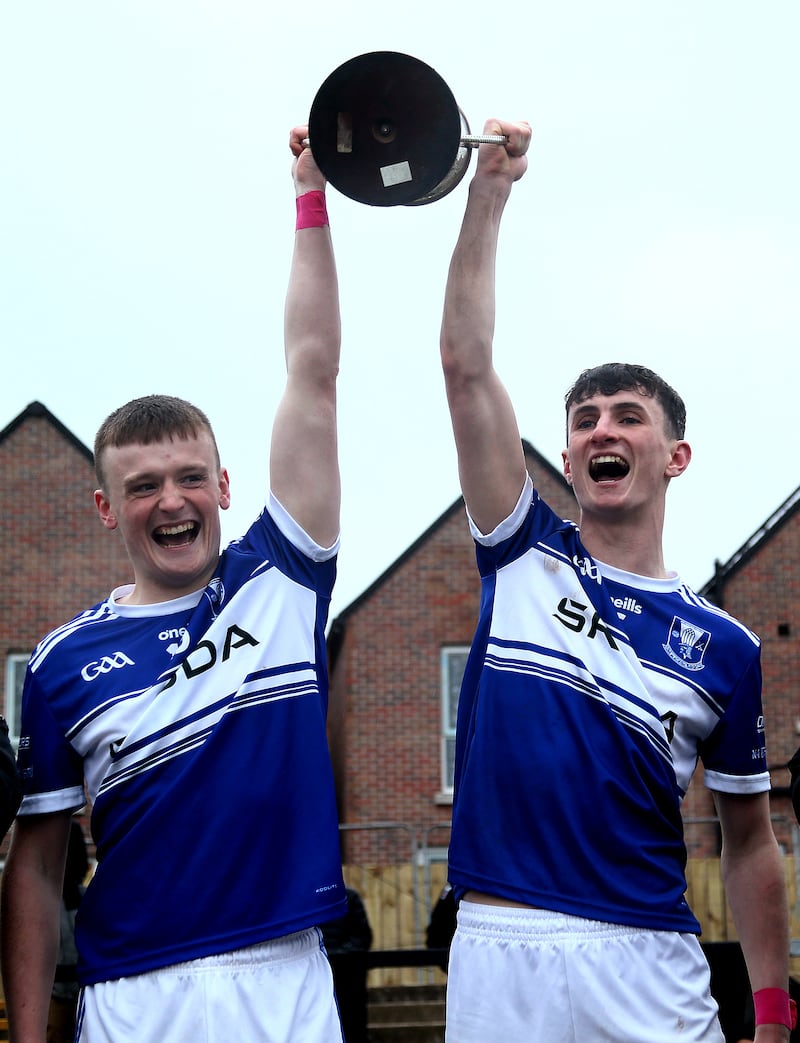 Four Masters' joint-captains Terence McGovern and Callum McCrea lift the Jimmy McConville Cup