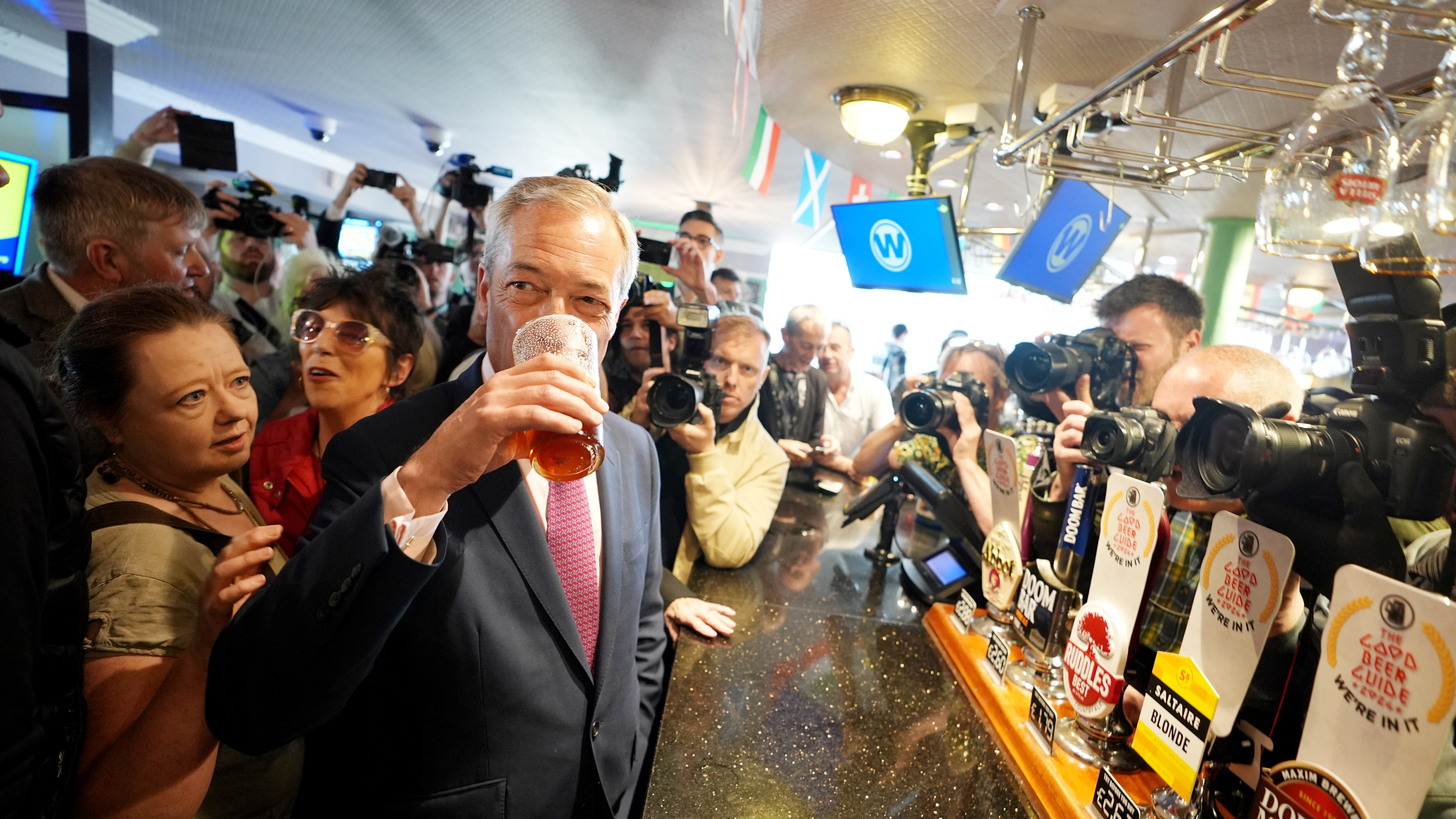 Leader of Reform UK Nigel Farage enjoys a pint of beer as he launches his General Election campaign in Clacton-on-Sea, Essex