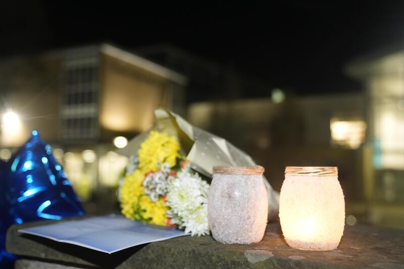 Tributes left outside All Saints Catholic High School on Monday night