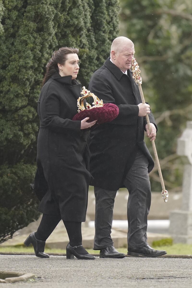 The crown and sceptre The Vivienne won on Ru Paul’s Drag Race UK are carried into the church ahead of their coffin