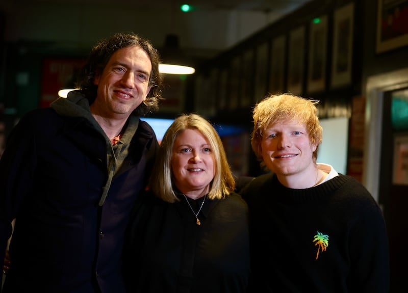 Ed Sheeran and Gary Lightbody  with Charlotte Dryden  who speak to the media at the Oh Yea Centre during a visit to Belfast.
PICTURE COLM LENAGHAN