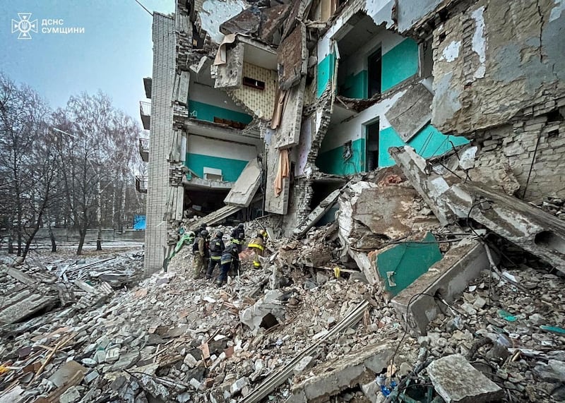 Rescue workers clear the rubble of a residential building destroyed by a Russian strike in Hlukhiv, Ukraine (Ukrainian Emergency Service/AP)