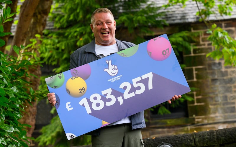 John McDowell, from Bathgate, West Lothian, celebrates winning the Euromillions .