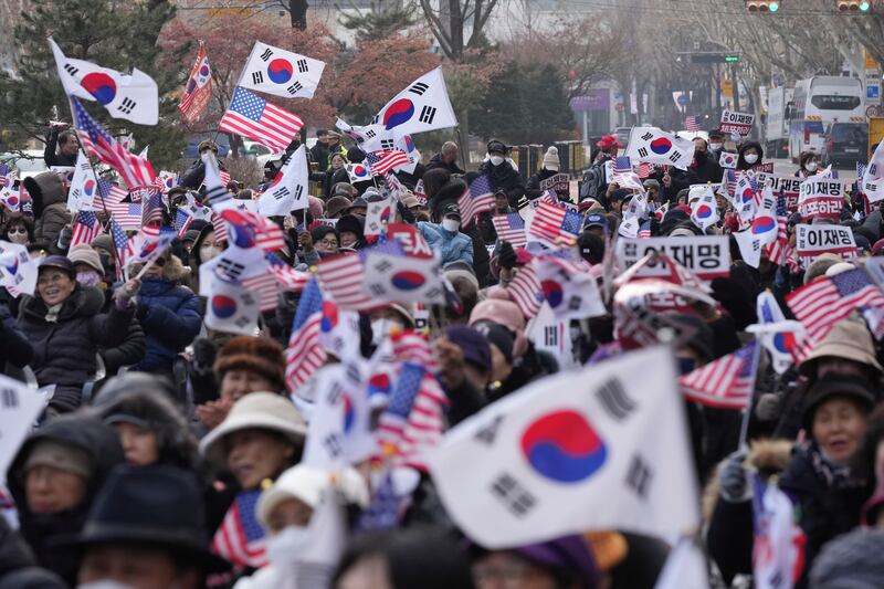 Supporters of impeached South Korean President Yoon Suk Yeol shout slogans during a rally to oppose his impeachment near the Constitutional Court in Seoul (Lee Jin-man/AP)