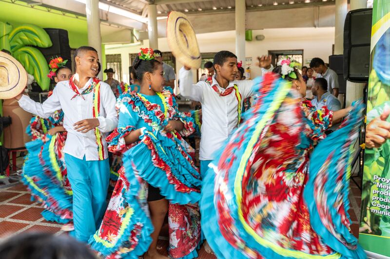 Children performing a traditional dance at the Coomulbanano Training Centre in Orihueca, in the region of Magdalena, Colombia in February 2024. (Chris Terry/Fairtrade)